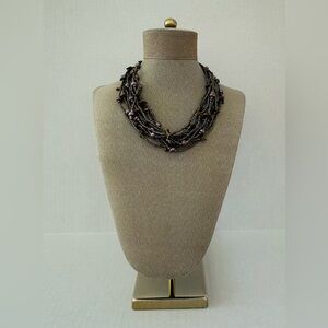 Vintage Multi-Strand Multicolor Glass Beaded Necklace with a Slide Lock Closure.